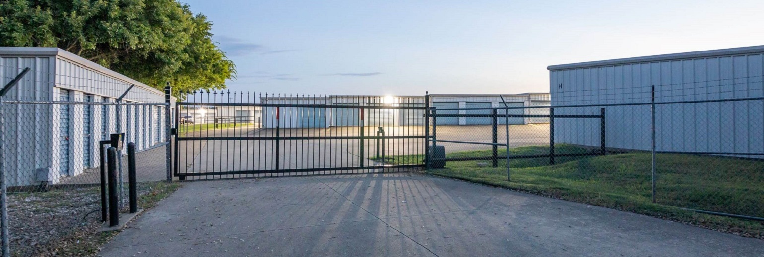View of rear entrance access panel and security gate at Joey's Self Storage in Waxahachie,TX